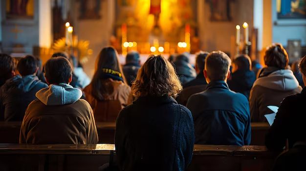 Young people listening in Catholic Church